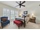 Charming bedroom features a floral bedspread, shuttered windows, and classic furniture accents at 4044 Murray St, Indian Land, SC 29707