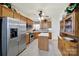 Well-equipped kitchen with stainless steel appliances, ample wood cabinets, and a functional island at 4044 Murray St, Indian Land, SC 29707