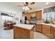 Traditional kitchen boasts stainless steel appliances, an island, and ample wood cabinet space at 4044 Murray St, Indian Land, SC 29707