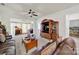 Spacious living room featuring leather sofas, a wooden cabinet, and a ceiling fan for added comfort at 4044 Murray St, Indian Land, SC 29707