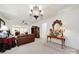 Elegant living room with a brown leather sofa, ornate mirror, and decorative lamps creating a luxurious space at 4044 Murray St, Indian Land, SC 29707