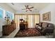 Living room featuring multiple windows, ceiling fan, and comfortable seating at 4044 Murray St, Indian Land, SC 29707
