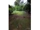 Damaged fence at the edge of the backyard at 409 Anne Ave, Waxhaw, NC 28173