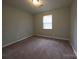 Bedroom with neutral paint and carpet at 409 Anne Ave, Waxhaw, NC 28173