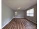 This bedroom is bright with fresh paint and clean wood-look floors ready for your personal touches at 409 Anne Ave, Waxhaw, NC 28173