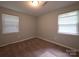 Bedroom with neutral paint and carpet featuring two windows at 409 Anne Ave, Waxhaw, NC 28173