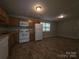 Bright kitchen featuring essential appliances and ample countertop space perfect for cooking at 409 Anne Ave, Waxhaw, NC 28173