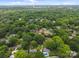 Captured from above, a serene neighborhood featuring dense trees and a mix of quaint residential homes at 4106 Castlewood Rd, Charlotte, NC 28209