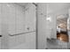 Modern bathroom showcasing tiled walk-in shower with glass door at 4106 Castlewood Rd, Charlotte, NC 28209