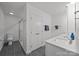 Modern bathroom features white vanity, walk-in shower, and separate toilet room at 4106 Castlewood Rd, Charlotte, NC 28209