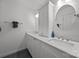 Bright bathroom boasts dual sinks, white cabinets, and stylish fixtures at 4106 Castlewood Rd, Charlotte, NC 28209