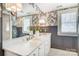 The bathroom features double sinks, a large mirror, and dark gray wallpaper at 501 E Tremont Ave, Charlotte, NC 28203