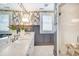 Bathroom featuring double sinks, granite counters, and a walk-in glass shower at 501 E Tremont Ave, Charlotte, NC 28203