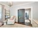 Bright Bedroom with a white glider, shelving for toys, and barn door at 501 E Tremont Ave, Charlotte, NC 28203
