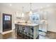 Eat-in kitchen features a center island with seating and white marble countertops at 501 E Tremont Ave, Charlotte, NC 28203