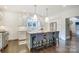 Eat-in kitchen features a center island with seating and white marble countertops at 501 E Tremont Ave, Charlotte, NC 28203