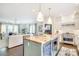 Kitchen with center island flows to the living area, showcasing an open layout at 501 E Tremont Ave, Charlotte, NC 28203