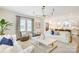 Open-concept living room flows into kitchen with natural light and hardwood floors at 501 E Tremont Ave, Charlotte, NC 28203