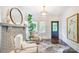 Stylish living room featuring hardwood floors, a brick fireplace, and bright windows creating a comfortable living space at 501 E Tremont Ave, Charlotte, NC 28203