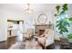 Bright living room with a fireplace, hardwood floors, and stylish decor creating an inviting and comfortable atmosphere at 501 E Tremont Ave, Charlotte, NC 28203