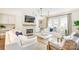 Bright living room with fireplace, TV, built-ins, neutral decor, and large windows at 501 E Tremont Ave, Charlotte, NC 28203