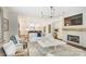 Inviting living room with fireplace, TV, and open access to the modern kitchen at 501 E Tremont Ave, Charlotte, NC 28203