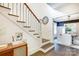Elegant staircase with stained wood treads, white risers, and an adjacent dining room at 501 E Tremont Ave, Charlotte, NC 28203