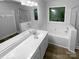 Bright bathroom with a soaking tub and an enclosed glass shower at 524 N Portman Ln, Fort Mill, SC 29708