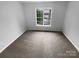 Clean bedroom with plush carpet, a big window and neutral paint at 524 N Portman Ln, Fort Mill, SC 29708