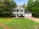 Charming two-story home with classic curb appeal, lush lawn and mature trees at 524 N Portman Ln, Fort Mill, SC 29708