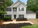 Charming two-story home with manicured lawn and two-car garage at 524 N Portman Ln, Fort Mill, SC 29708