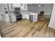 Modern kitchen features stainless steel appliances, granite countertops, and ample cabinet space at 524 N Portman Ln, Fort Mill, SC 29708