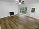 Bright living room featuring a fireplace and natural light at 524 N Portman Ln, Fort Mill, SC 29708