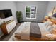 Serene main bedroom with a cozy rug, dresser and natural light at 524 N Portman Ln, Fort Mill, SC 29708