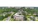 An aerial view of the building surrounded by trees, homes, and buildings at 5425 Closeburn Rd # 208, Charlotte, NC 28210