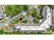 An aerial view showing the beautiful landscaping and ample parking surrounding the building at 5425 Closeburn Rd # 208, Charlotte, NC 28210