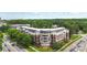 Aerial view of the condominium, highlighting the architecture and location near main thoroughfare at 5425 Closeburn Rd # 208, Charlotte, NC 28210