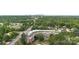 Wide aerial shot of the building, parking lot, and surrounding tree-covered area at 5425 Closeburn Rd # 208, Charlotte, NC 28210