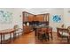 Inviting bar area featuring custom cabinetry, granite countertops, wine storage, and seating at 5425 Closeburn Rd # 208, Charlotte, NC 28210