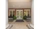 Elegant building entrance with symmetrical design, planters, and benches at 5425 Closeburn Rd # 208, Charlotte, NC 28210