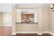 Stylish kitchen featuring wood cabinets, stainless steel appliances, and a sleek breakfast bar at 5425 Closeburn Rd # 208, Charlotte, NC 28210