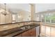 Granite countertops and stainless sink, looking into the living room at 5425 Closeburn Rd # 208, Charlotte, NC 28210
