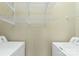 Bright laundry room with shelving, ready for washer and dryer at 5425 Closeburn Rd # 208, Charlotte, NC 28210