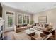 Bright living room features hardwood floors, neutral walls, and two couches for gathering at 5425 Closeburn Rd # 208, Charlotte, NC 28210