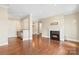 Open-concept living area with kitchen view and a cozy fireplace at 5425 Closeburn Rd # 208, Charlotte, NC 28210