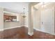 Spacious living room with hardwood floors, elegant chandelier, and an open layout for entertaining at 5425 Closeburn Rd # 208, Charlotte, NC 28210