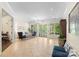 Open lobby area with elegant chandelier, tile flooring, and views to dining at 5425 Closeburn Rd # 208, Charlotte, NC 28210