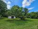 Large yard with a shed and mature trees at 562 W Wilson Ave, Mooresville, NC 28115