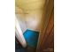 Narrow walk-in closet with blue flooring and wooden walls and ceiling at 562 W Wilson Ave, Mooresville, NC 28115