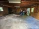 Spacious garage featuring shelving and exposed beams at 562 W Wilson Ave, Mooresville, NC 28115
